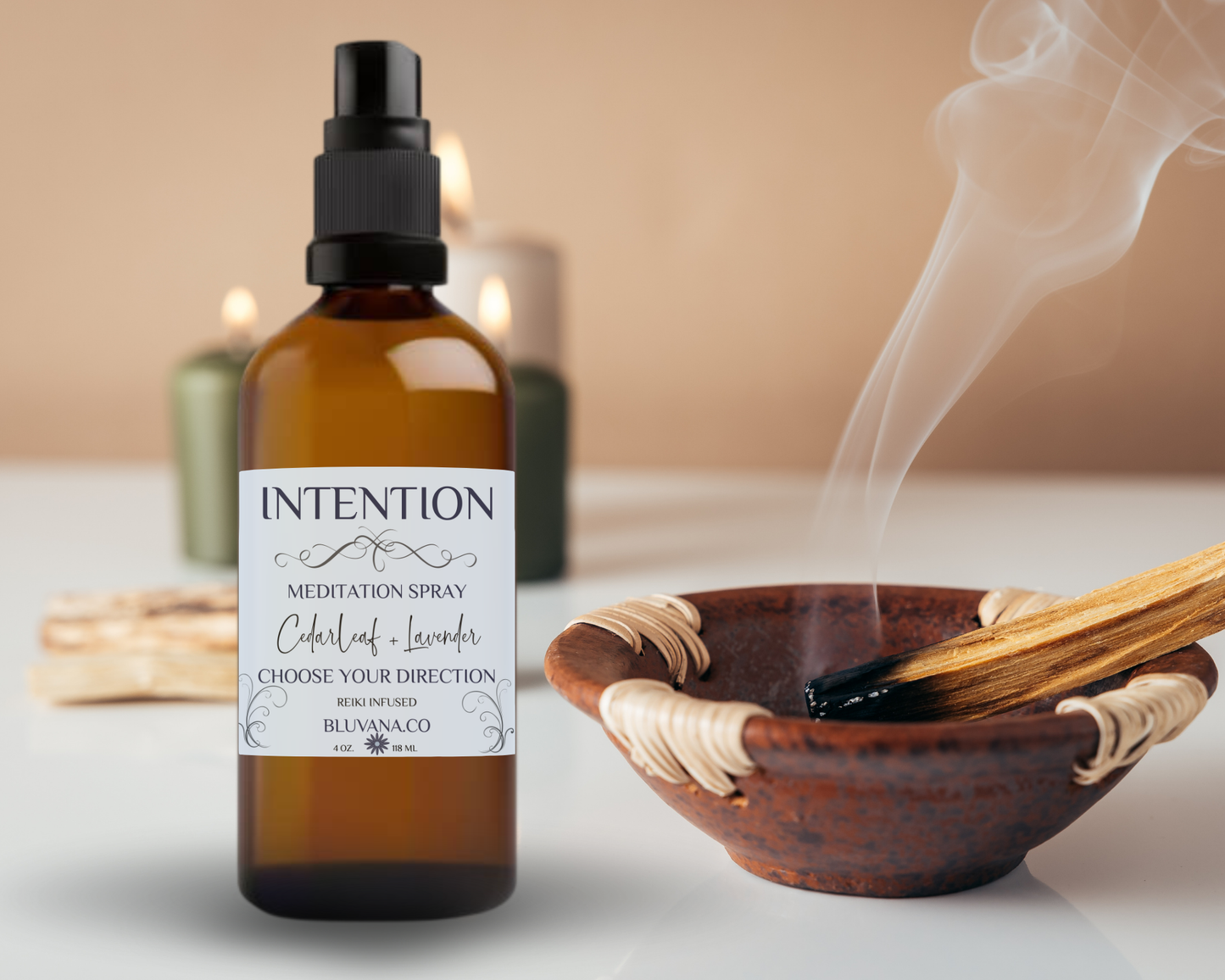Meditation spray bottle labeled 'Intention' with a smoking bowl and wooden sticks on a neutral background.