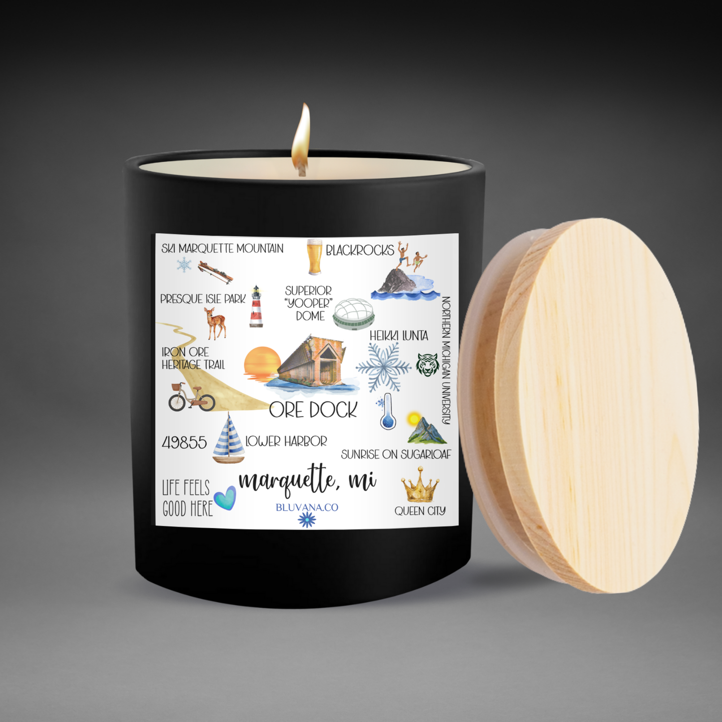 Candle with a decorative label on a gray background