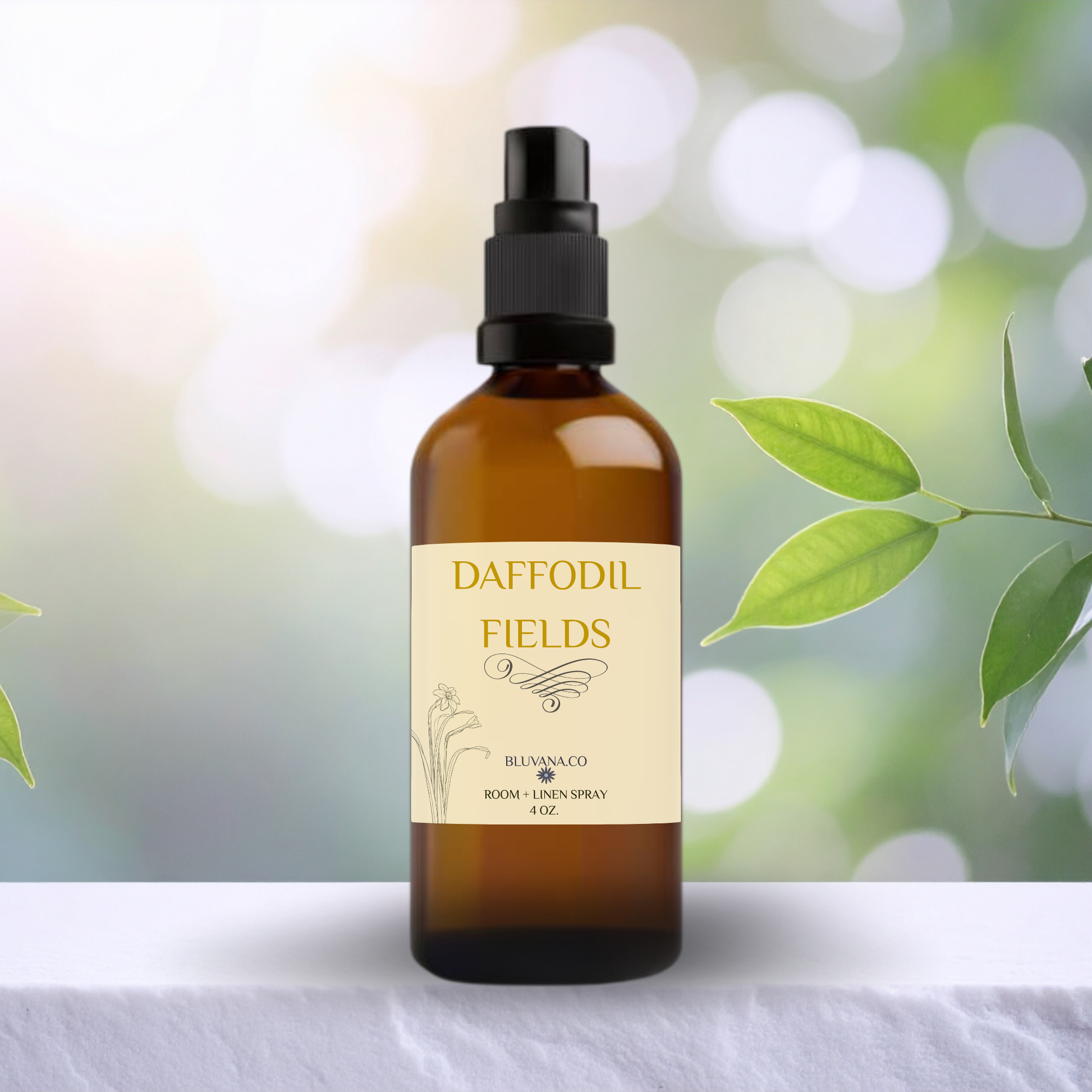 Brown spray bottle with 'Daffodil Fields' label on a white surface with green leaves in the background