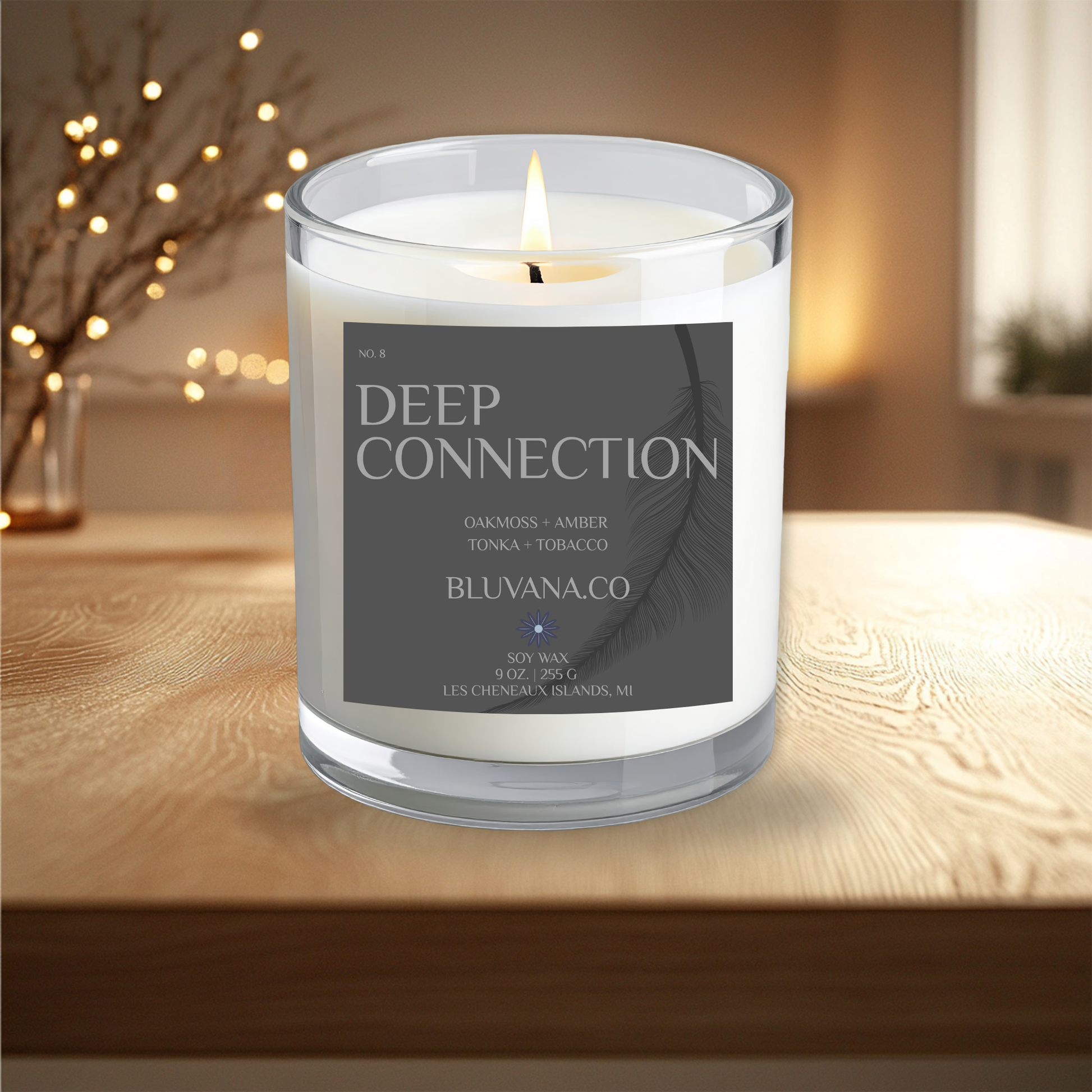 Candle labeled 'Deep Connection' by BLUVANA.CO on a wooden surface with a blurred background