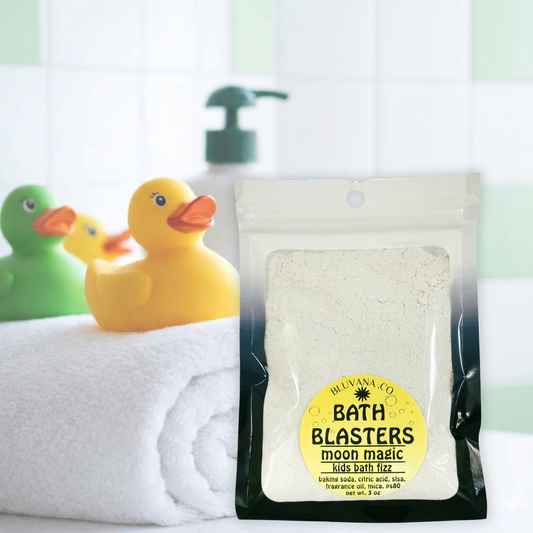 Image of a package of foaming bath fizz with a yellow rubber duck sitting next to it. 