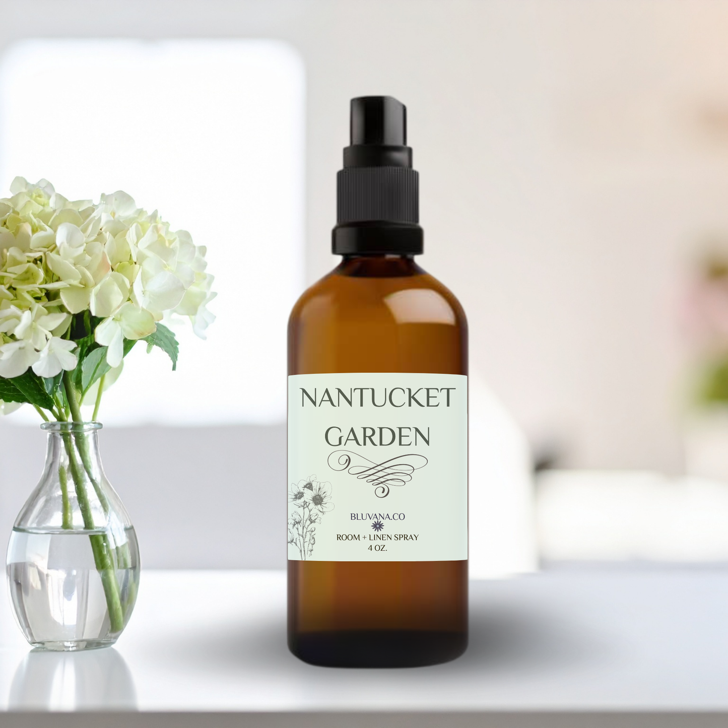 Nantucket Garen room and linen spray bottle with a clear vase of flowers on a table.