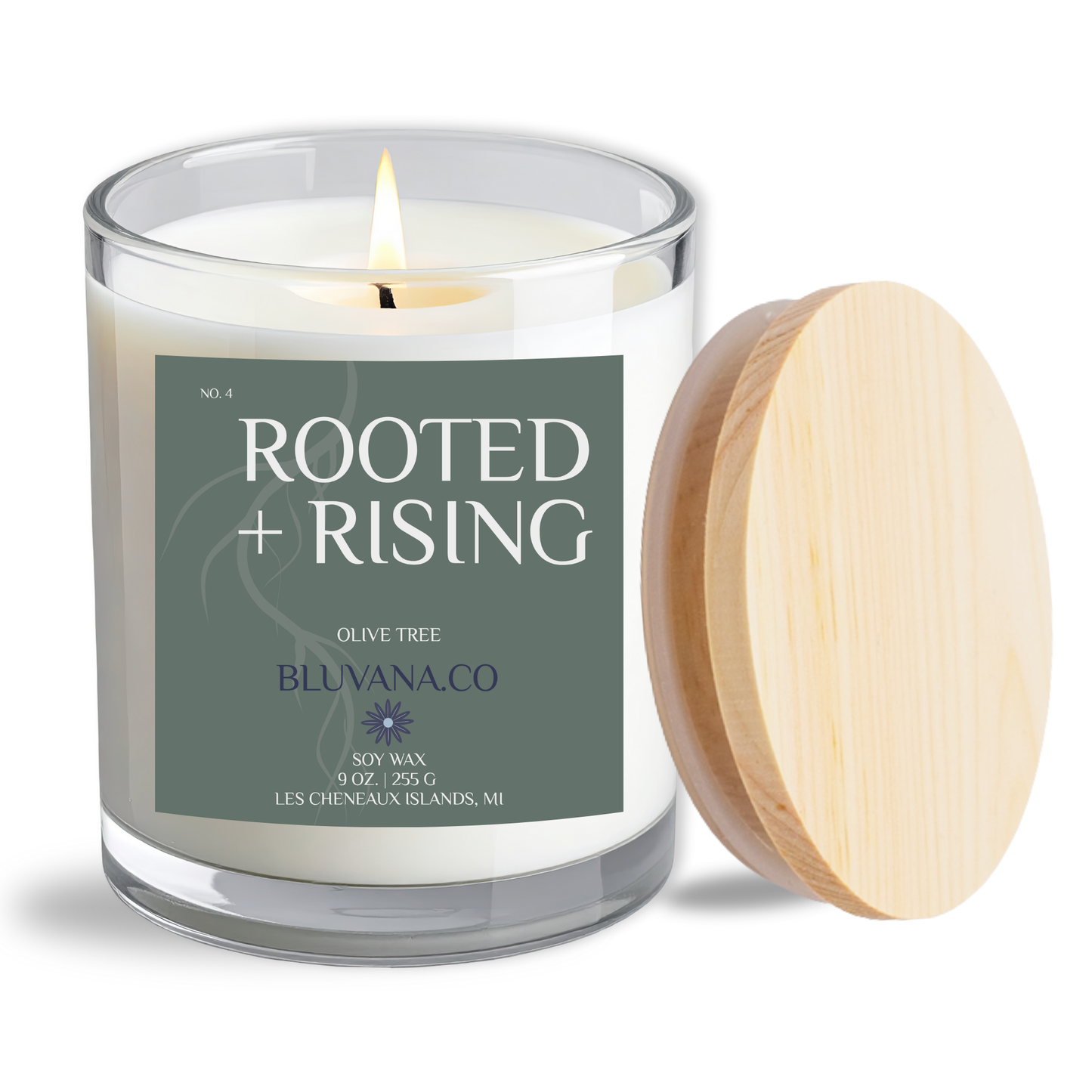 Candle with 'Rooted + Rising' label and wooden lid on a white background