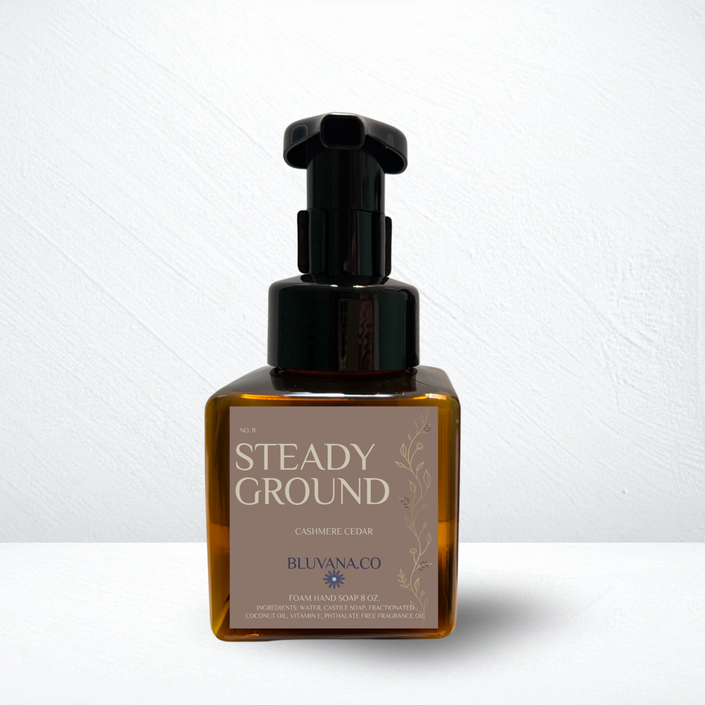 Bottle of 'Steady Ground' soap with pump on a white background