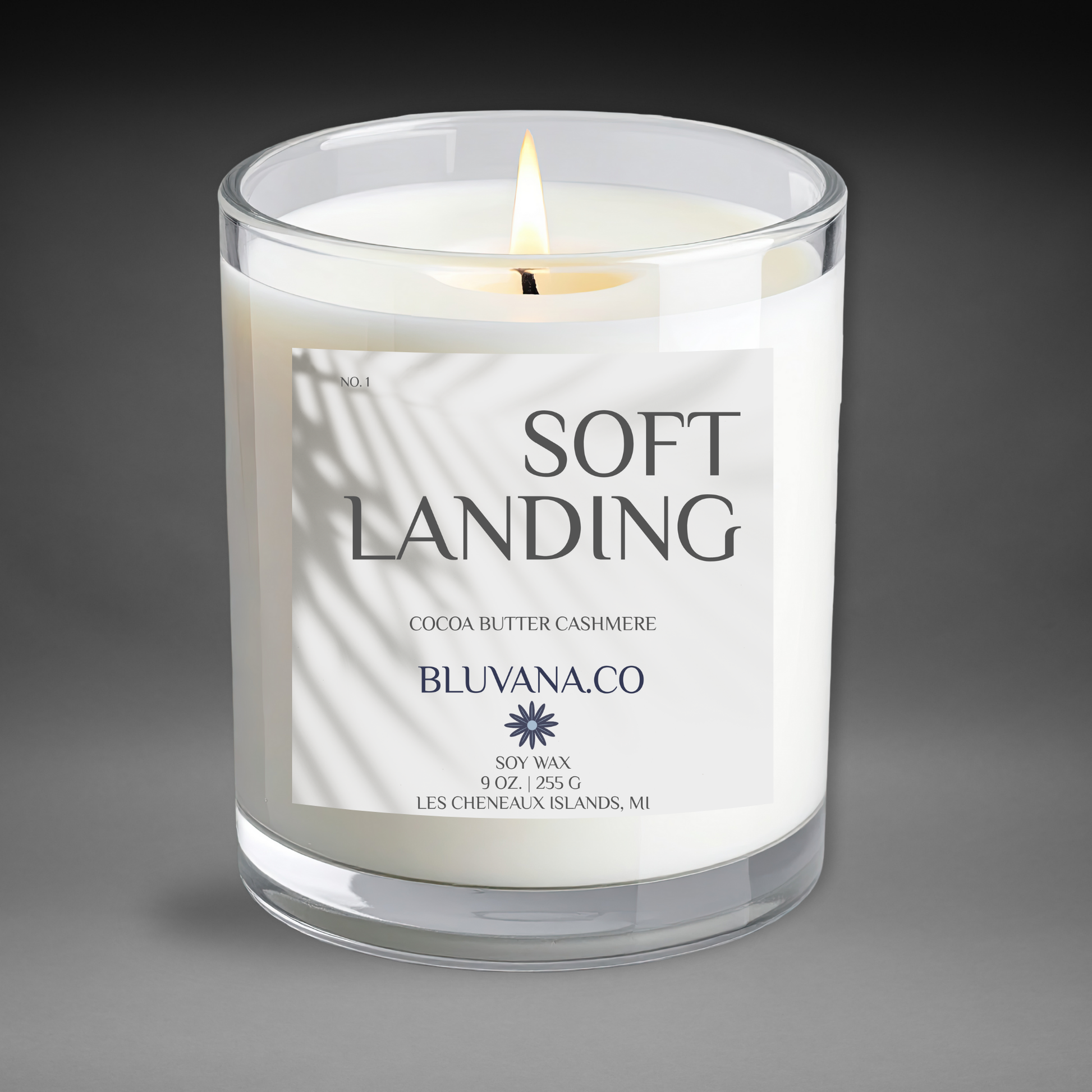 Candle with 'Soft Landing' label on a gray background