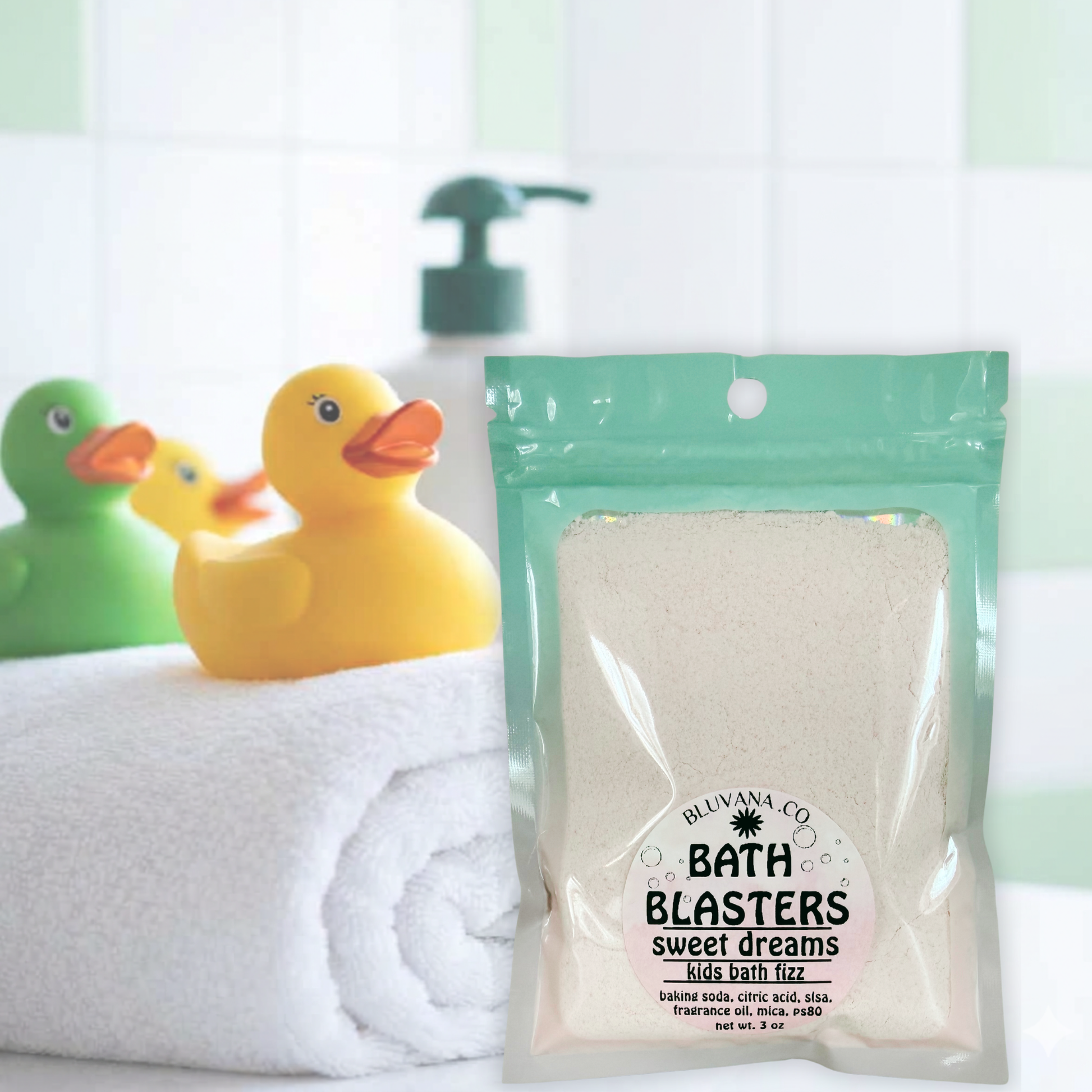 Image of a colorful package of bath fizz sitting on a tub edge with rubber ducky next to it. 